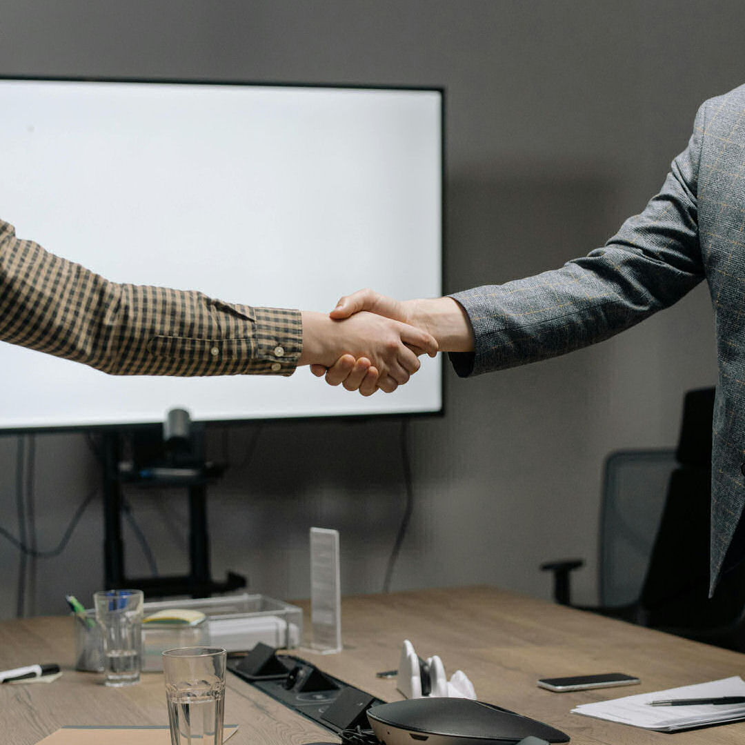 Business consultancy handshake — WLC Ltd partnership approach